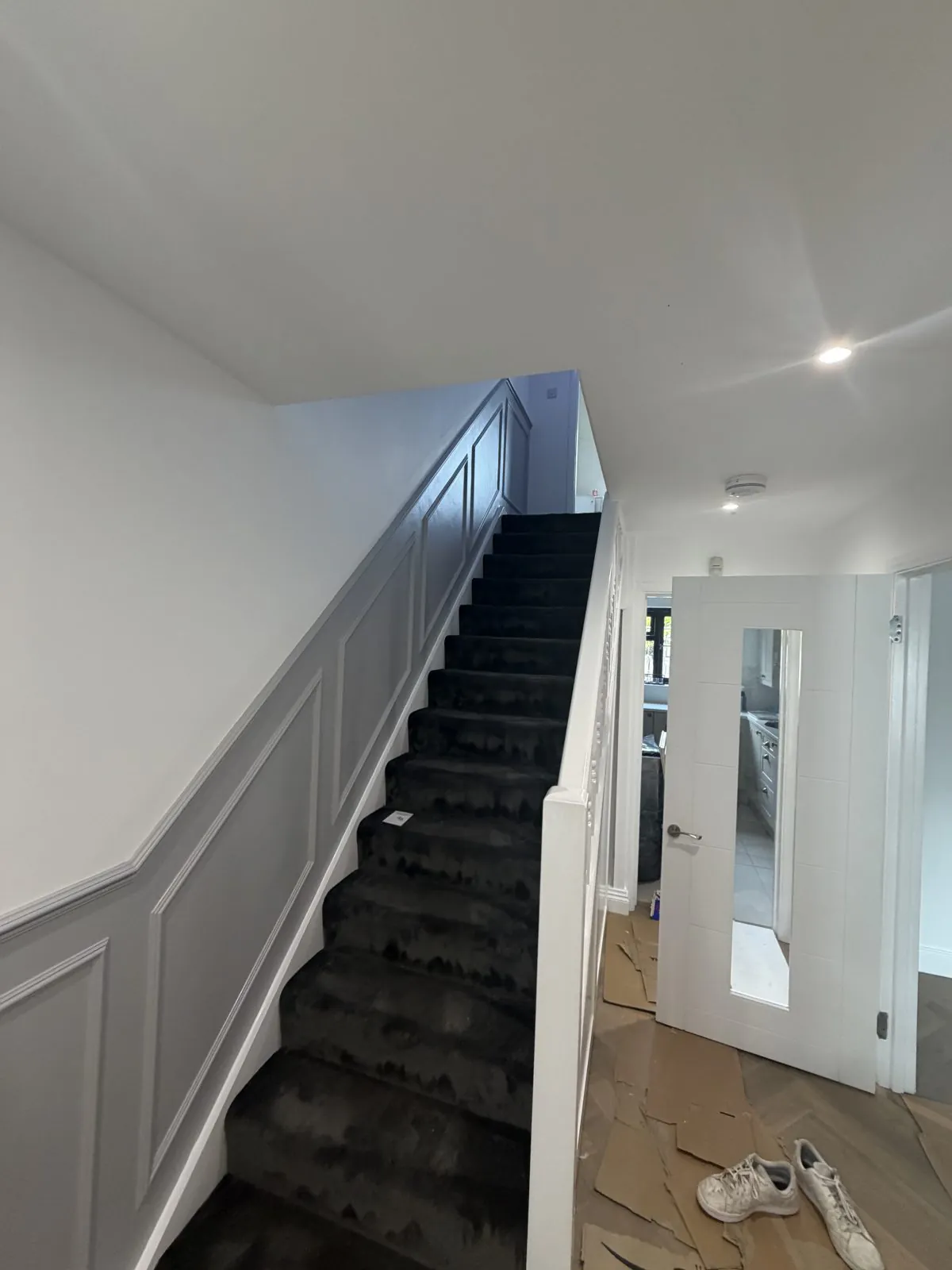 Grey painted staircase and panelling